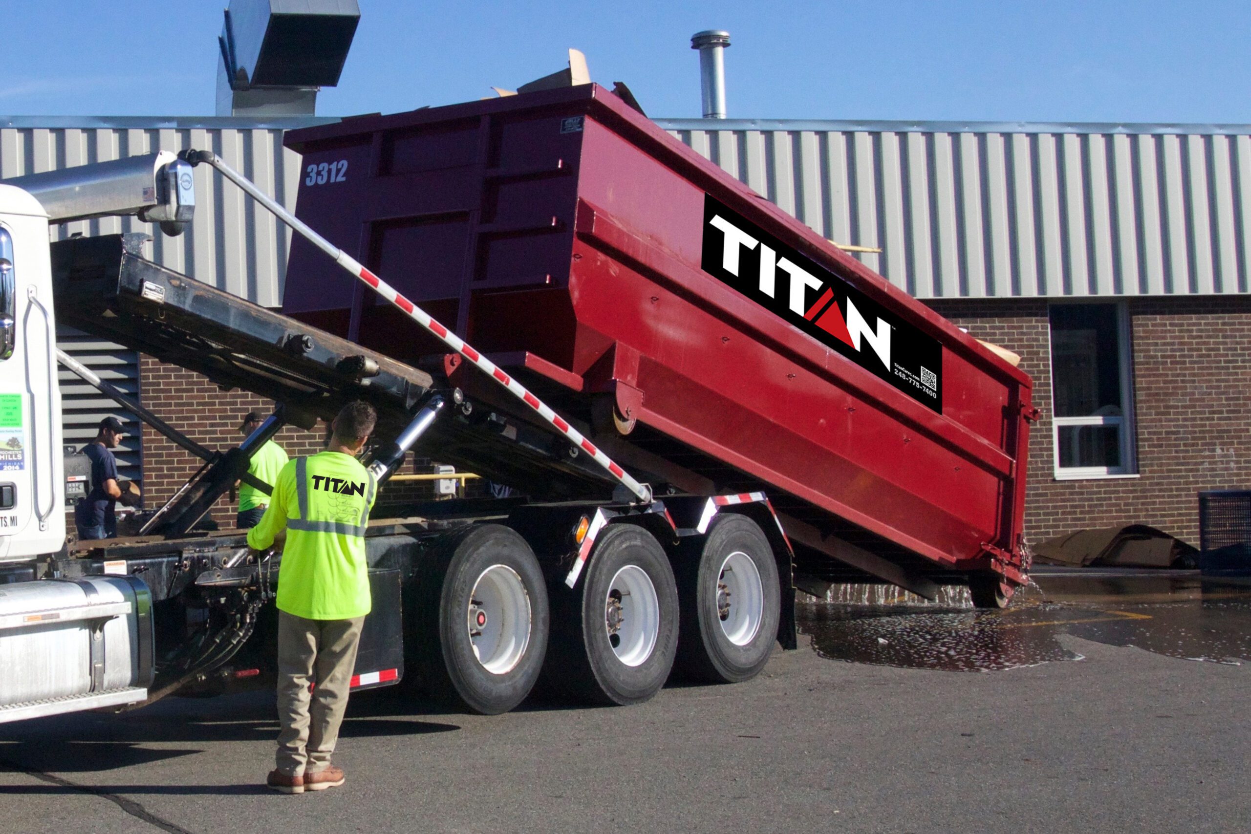 Titan Dumpster Rental Being Dropped Off at Customer